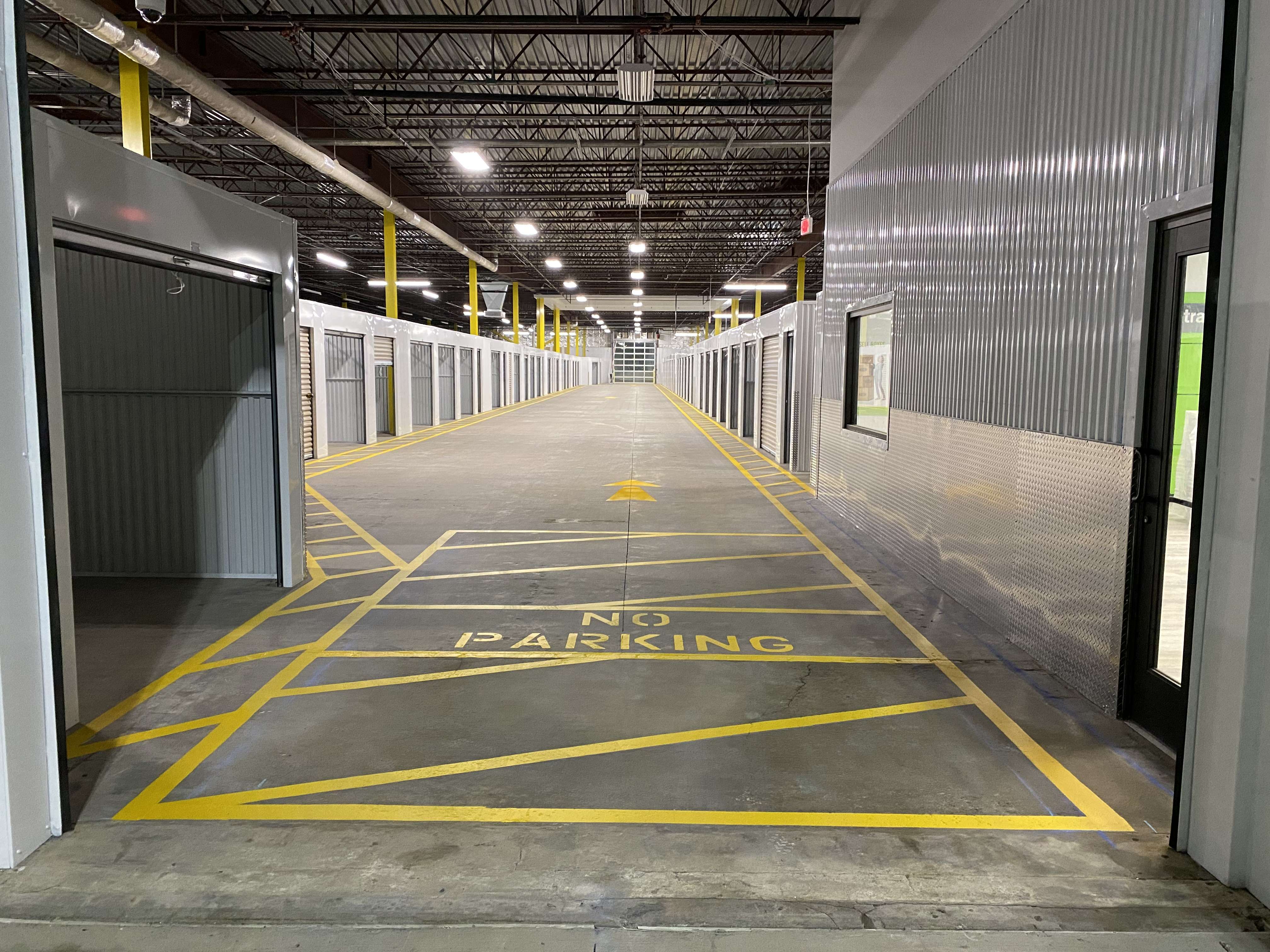 Bright red fire lane striping on commercial parking lot in SW Chicago