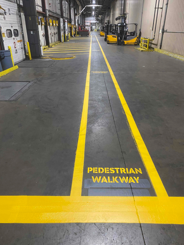 Striped warehouse floor with pedestrian walkways and forklift lanes in Chicagoland